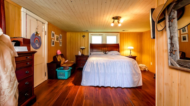 bedroom with wood walls, wooden ceiling, and dark hardwood / wood-style flooring