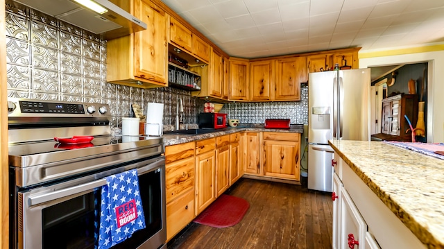 kitchen with backsplash, custom exhaust hood, light stone counters, dark hardwood / wood-style floors, and stainless steel appliances