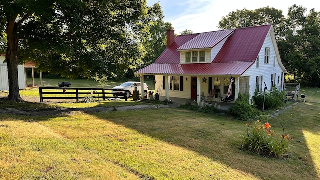 back of house with a lawn and a porch