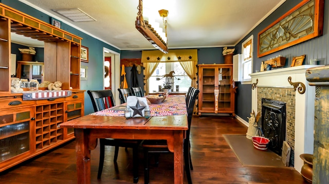 dining room featuring dark hardwood / wood-style floors and ornamental molding