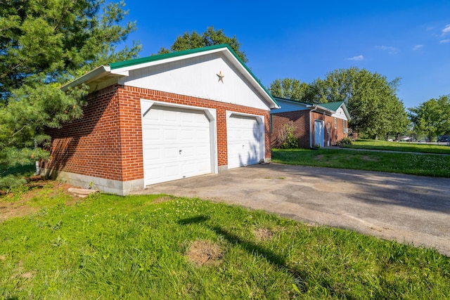 garage featuring a yard