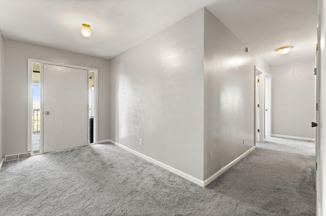 view of carpeted foyer