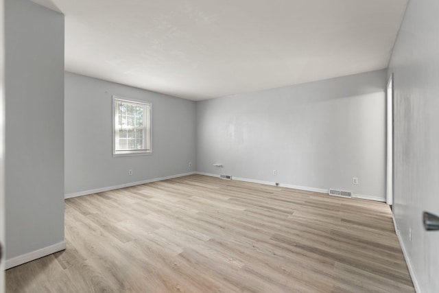 spare room with light hardwood / wood-style flooring