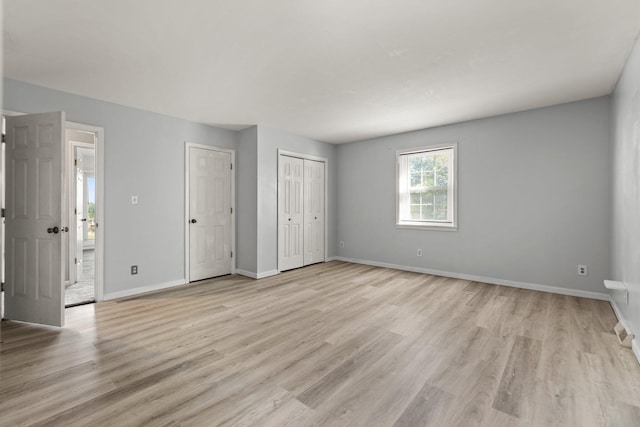 unfurnished bedroom with light hardwood / wood-style floors