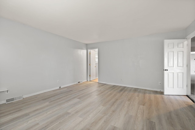 unfurnished room featuring light wood-type flooring