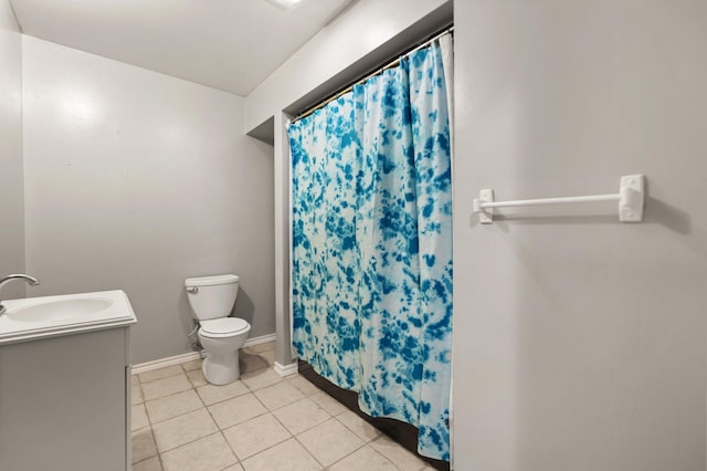 bathroom featuring a shower with shower curtain, vanity, toilet, and tile patterned floors