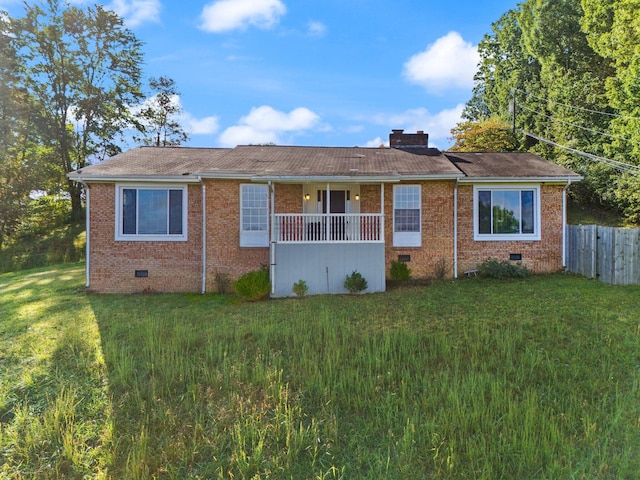 ranch-style house featuring a front lawn