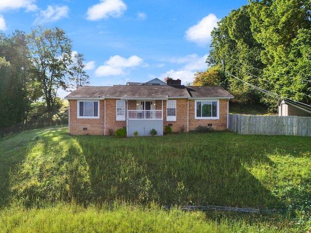 ranch-style house featuring a front lawn