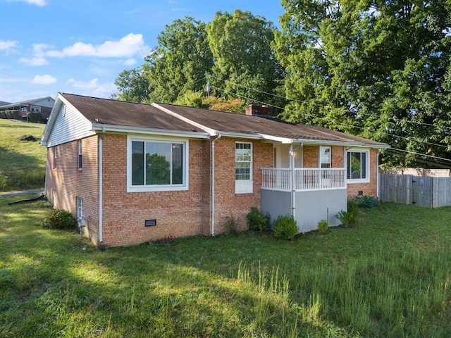 ranch-style home with a front lawn