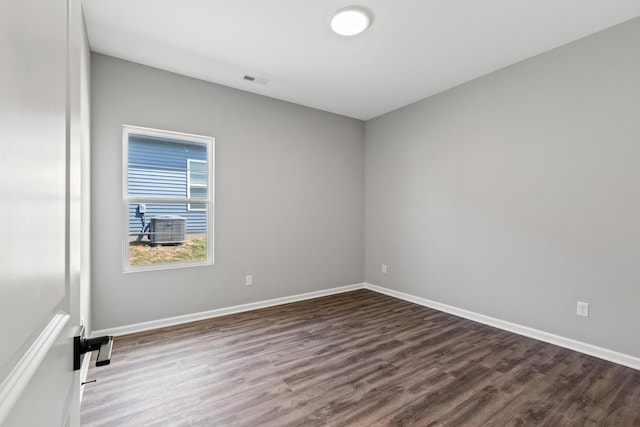 spare room with wood-type flooring