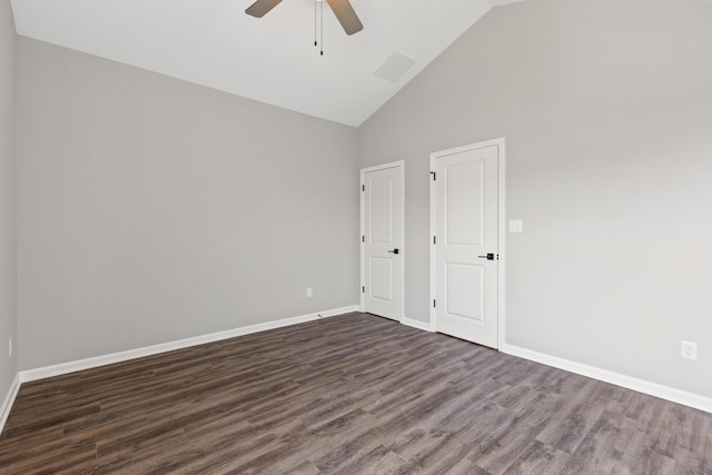 empty room with ceiling fan, high vaulted ceiling, and dark hardwood / wood-style flooring