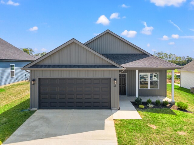 view of front facade with a front lawn and a garage