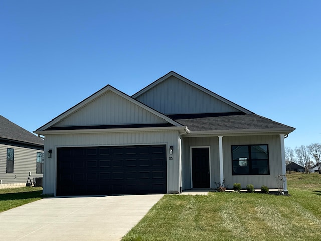 view of front of house featuring a front yard and a garage