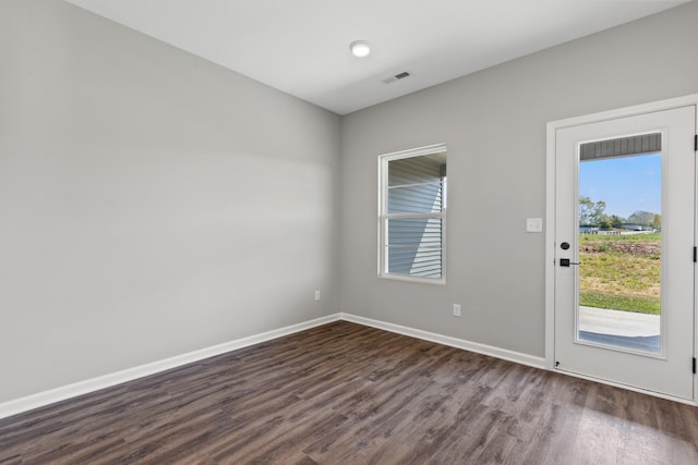 unfurnished room featuring dark hardwood / wood-style floors