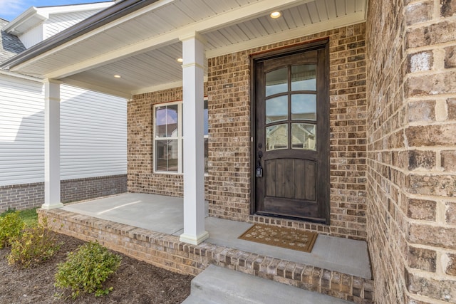 entrance foyer with a high ceiling, crown molding, and hardwood / wood-style floors