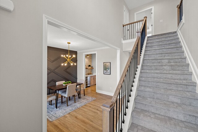 unfurnished living room featuring built in shelves and crown molding