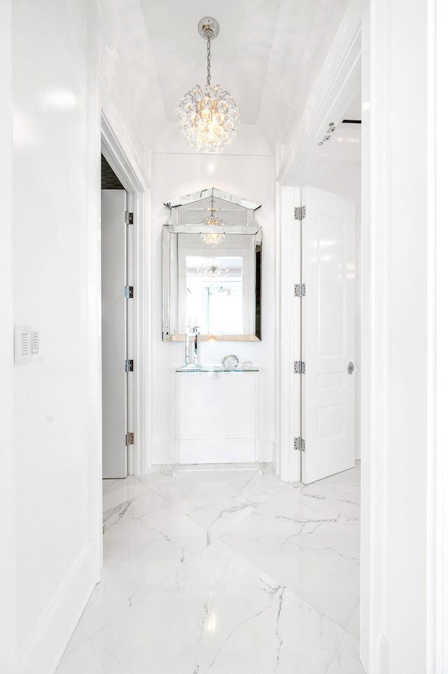 corridor featuring a notable chandelier and light tile flooring