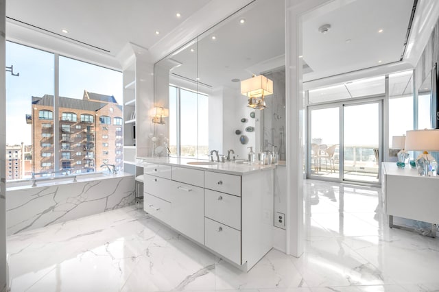 bathroom with tile flooring, plenty of natural light, and vanity