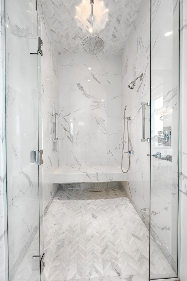 bathroom with a shower with shower door