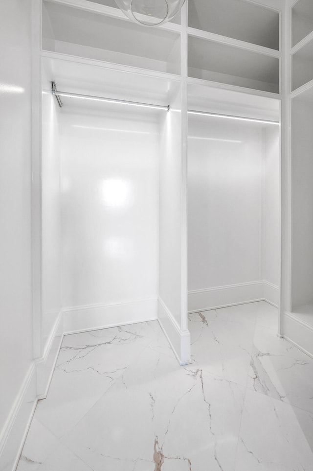 spacious closet featuring tile flooring