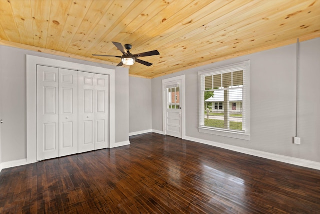 unfurnished bedroom with ceiling fan, a closet, hardwood / wood-style floors, and wooden ceiling