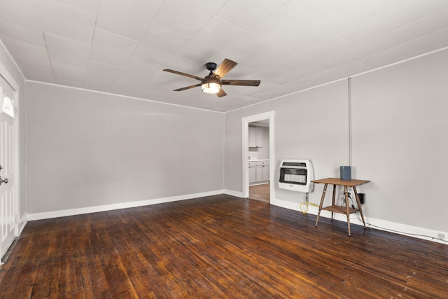 unfurnished room featuring heating unit, ceiling fan, and hardwood / wood-style floors