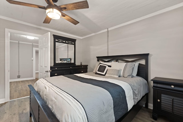 bedroom featuring ornamental molding, hardwood / wood-style floors, and ceiling fan