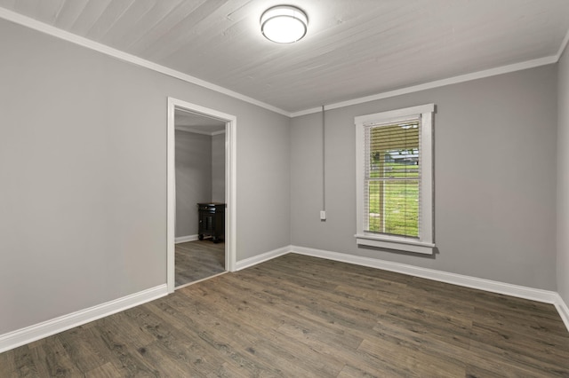 empty room featuring wood-type flooring and ornamental molding