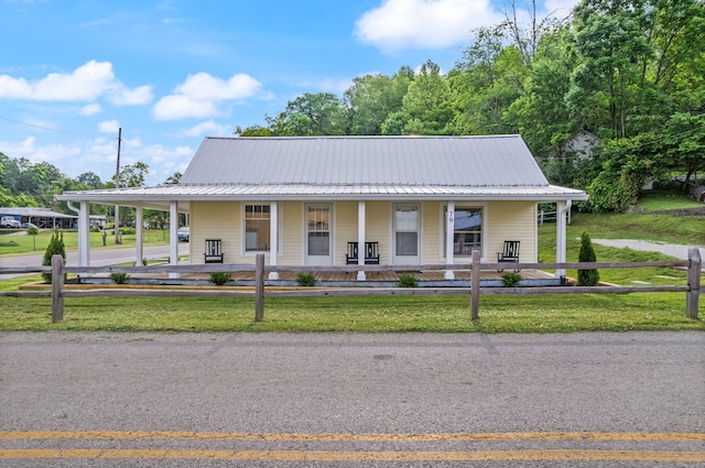 farmhouse-style home featuring covered porch