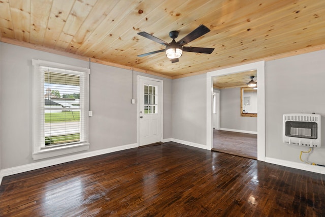 empty room with wood ceiling, heating unit, ceiling fan, and hardwood / wood-style floors