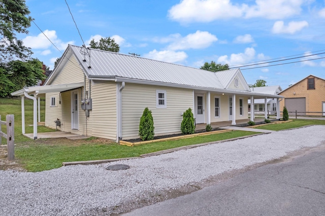 79 Washington St, Campton, KY 41301 - country-style home featuring a porch and metal roof