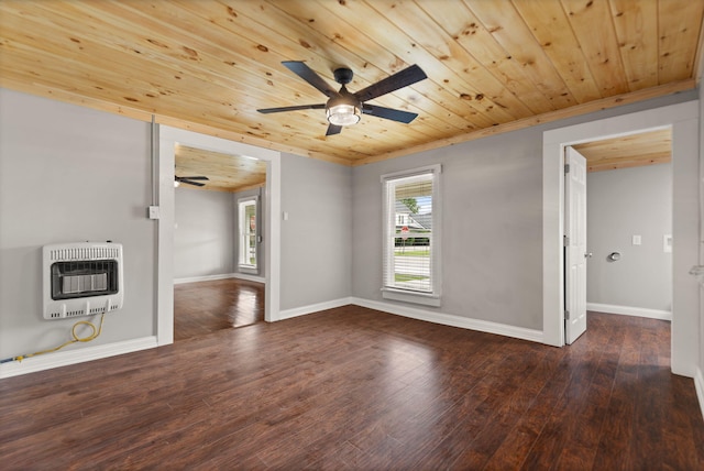 empty room with hardwood / wood-style floors, heating unit, wood ceiling, and ceiling fan