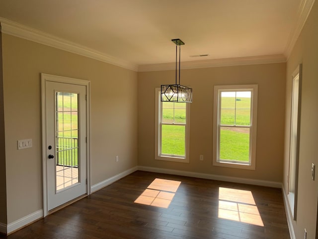 unfurnished dining area with a healthy amount of sunlight, ornamental molding, and dark hardwood / wood-style flooring