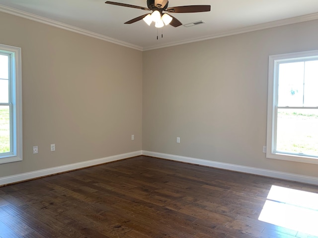 spare room with ceiling fan, dark hardwood / wood-style flooring, and crown molding