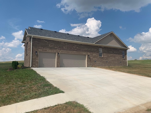 exterior space with a garage and a front lawn