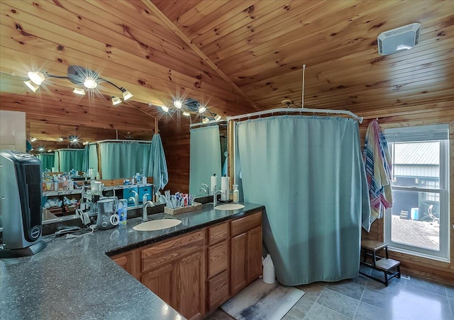 bathroom with high vaulted ceiling, wooden walls, wooden ceiling, and vanity