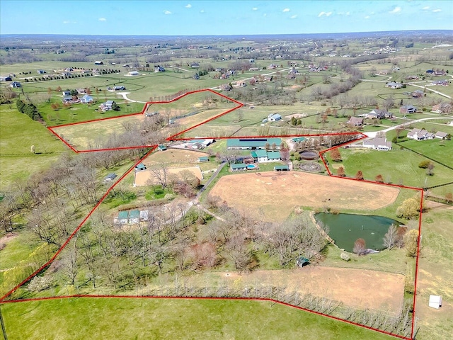 aerial view with a water view and a rural view