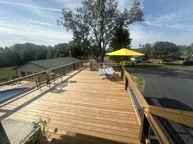 view of dock with a swimming pool