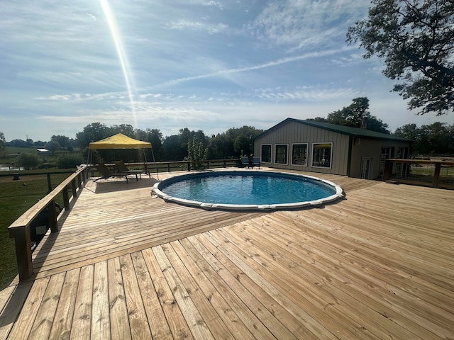 view of pool featuring a gazebo and a deck