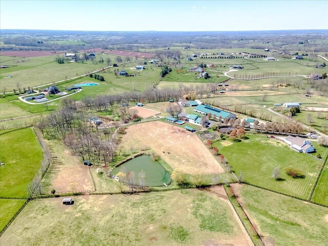 drone / aerial view featuring a water view and a rural view