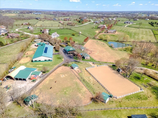 drone / aerial view with a water view and a rural view