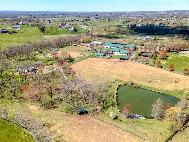 birds eye view of property featuring a water view and a rural view