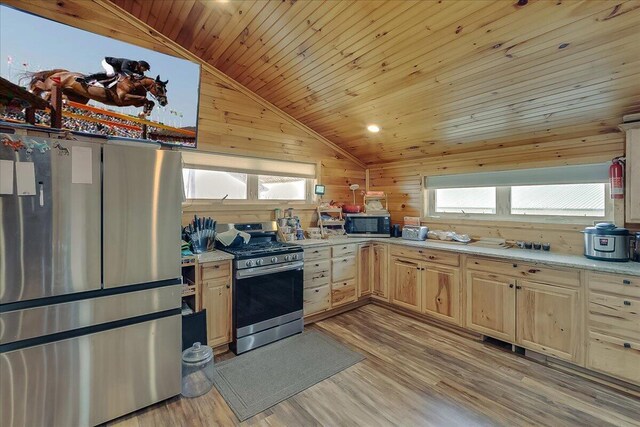 kitchen with wood walls, stainless steel appliances, wood ceiling, lofted ceiling, and light hardwood / wood-style floors