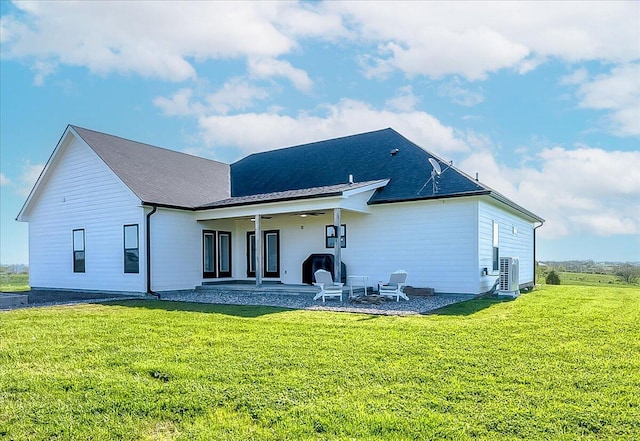 back of house featuring a lawn, ceiling fan, central AC unit, and a patio area