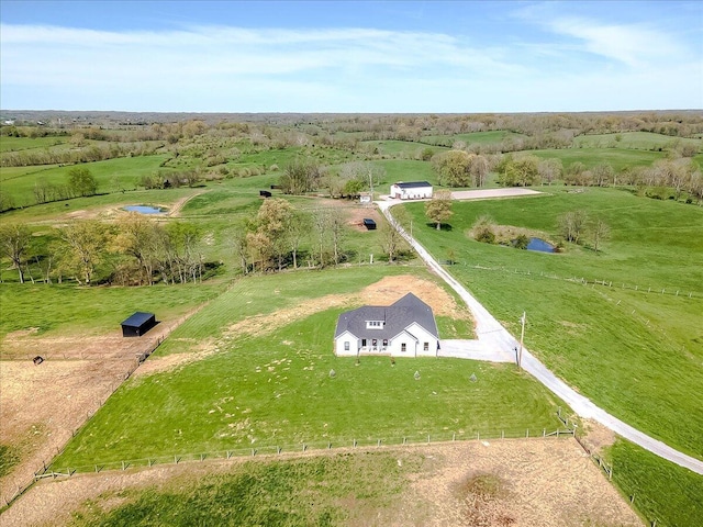 birds eye view of property featuring a rural view