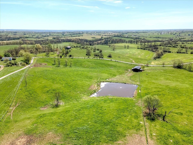 birds eye view of property with a rural view