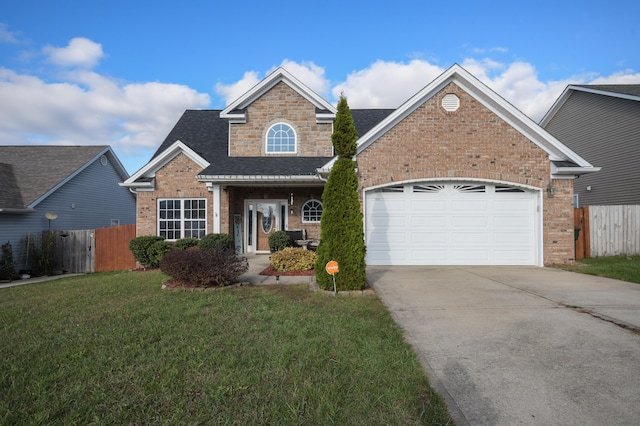 front of property with a front lawn and a garage