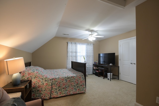 bedroom with ceiling fan, light carpet, and lofted ceiling