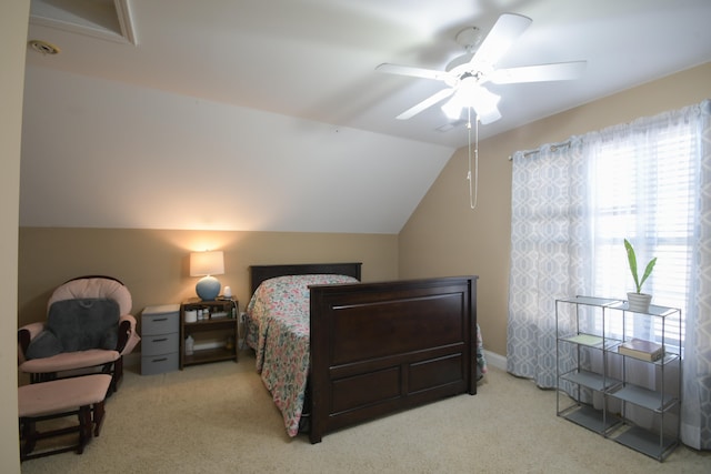 bedroom with ceiling fan, light carpet, and lofted ceiling