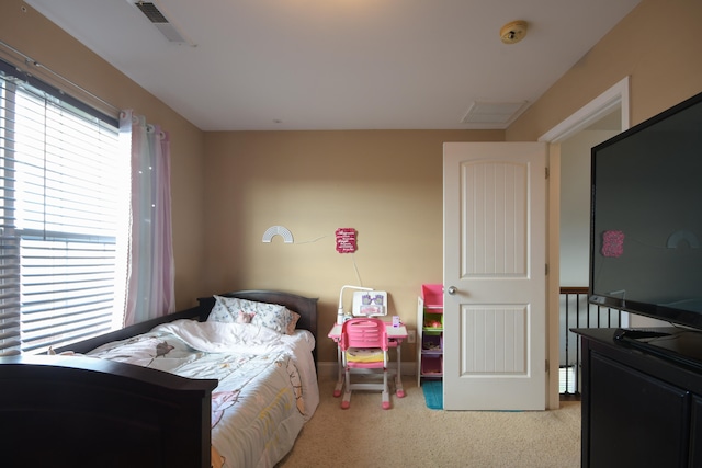 bedroom with light carpet